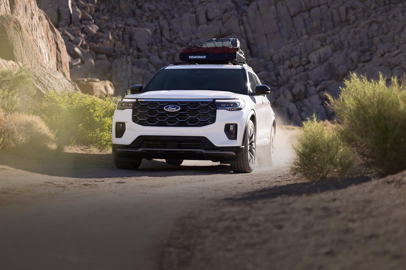 Ford Explorer Platinum driving through a canyon, shown for Explorer versus Expedition shoppers in Gordon, TX