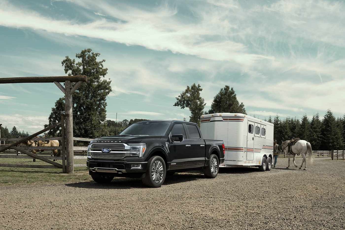 Ford F-150 XLT in Agate Black hitched to a horse trailer, the kind of work truck Gordon, TX ranch owners run