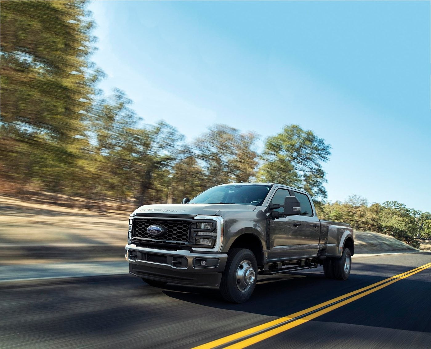 Ford Super Duty F-350 XL with the STX Appearance Package driving on a paved road